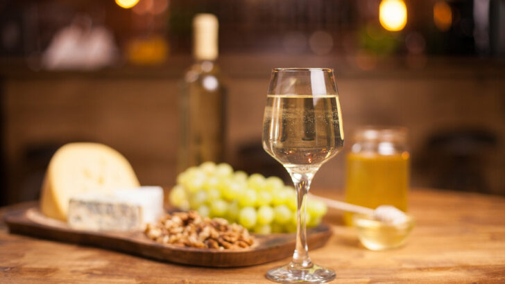 Sparkling white wine on a rustic wooden table